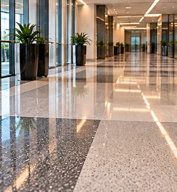 Polished terrazzo floor in a long office corridor